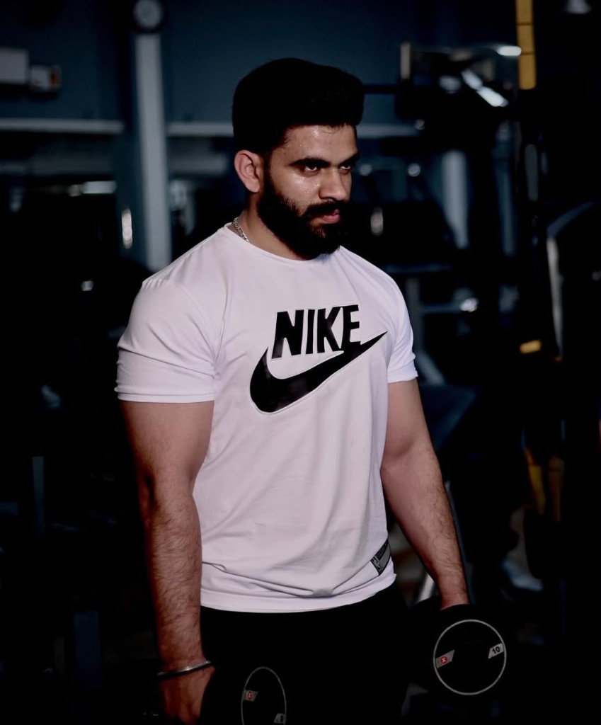 Portrait of Sanjeev Kumar, personal trainer, in a gym