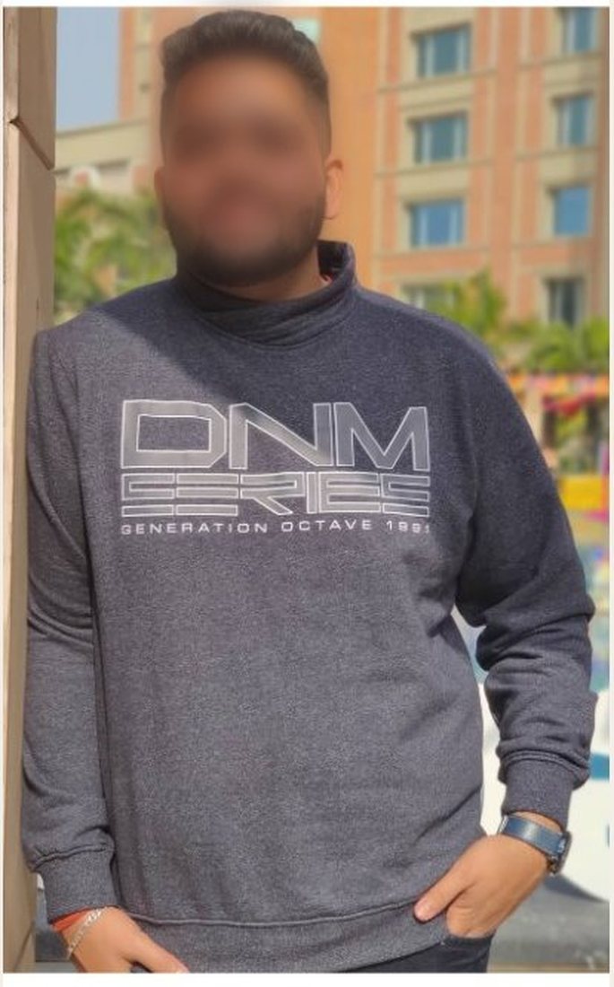 Before photo from a client fitness transformation, face softly blurred for privacy