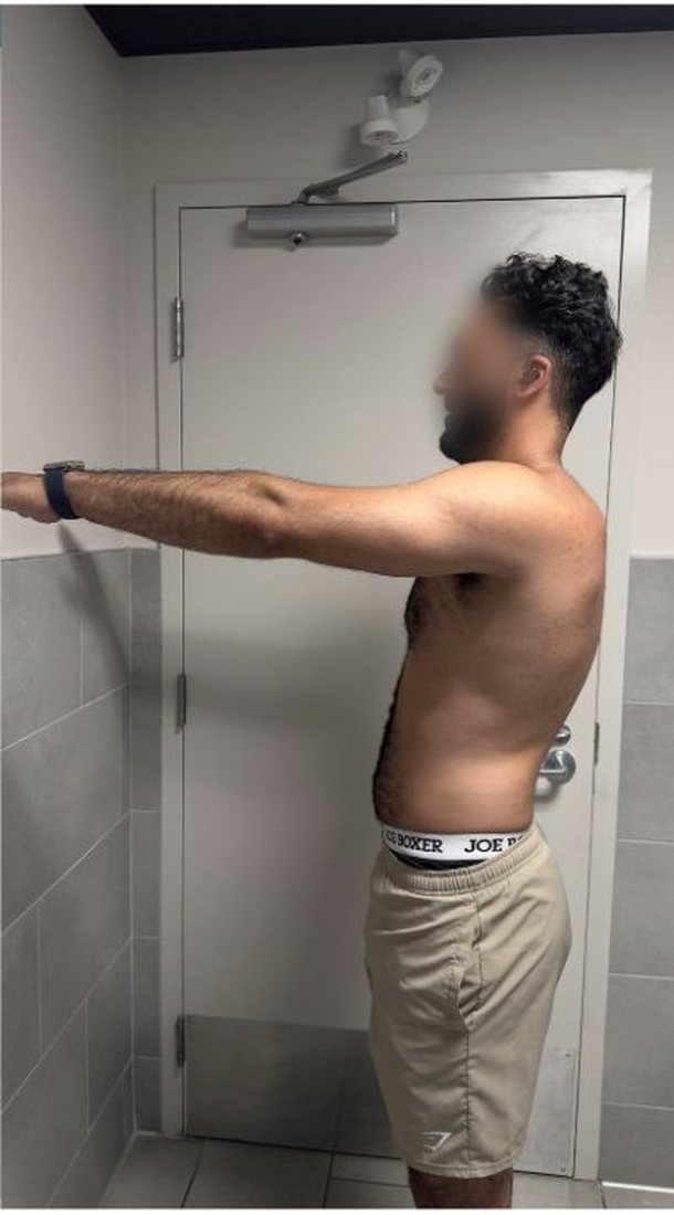 After photo from a client fitness transformation, face softly blurred for privacy
